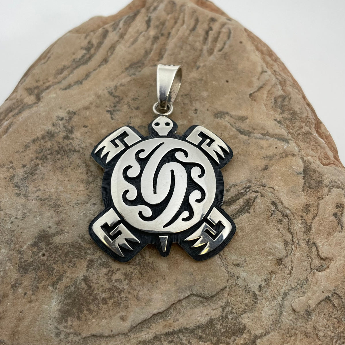 Turtle and Storm Hopi Silver Pendant, by Ruben Saufkie